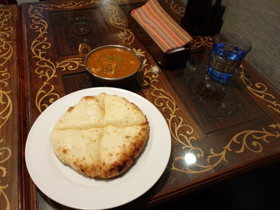 Curry in a copper kadai with naan at ANNAM Indian Restaurant, Ginza