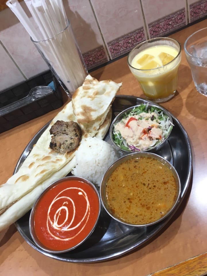 Seekh kebab and naan with butter chicken and mango lassi at Potohar Halal Indian Restaurant