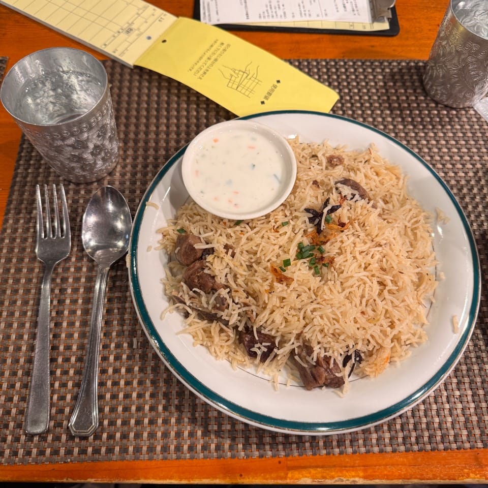 Mutton biryani with raita at Nawab Biryani House, Kayabacho
