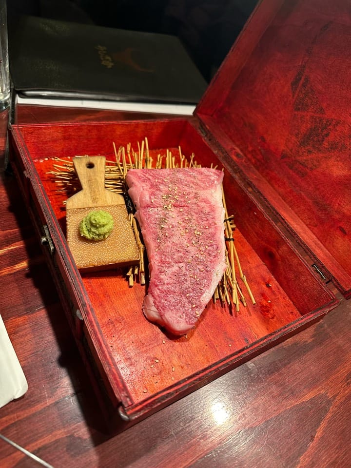 A sirloin cut served in a lacquered box with fresh wasabi at Sumibi Yakiniku Ushizaka, Nishi-Azabu