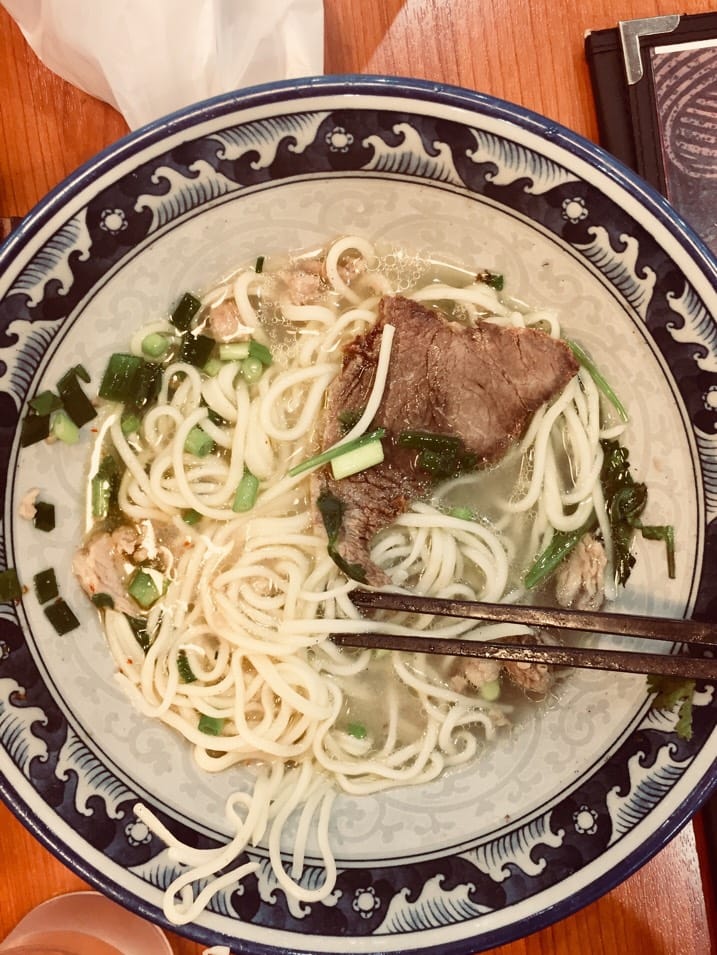 Hand-pulled Lanzhou beef noodles in a clear broth — the Hui Muslim dish this cluster is built on at Kaenzan Lanzhou Lamian, Ikebukuro