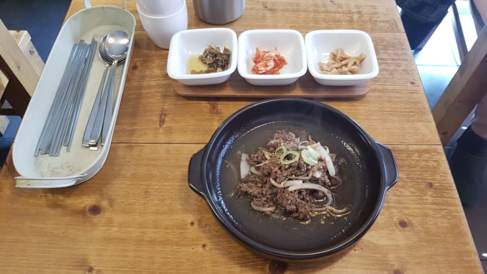Beef bulgogi with side dishes at EID Halal Korean Food